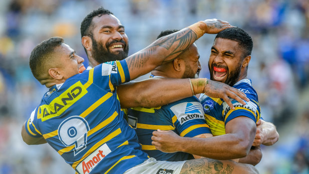 Wild scenes: Michael Jennings and the Eels celebrate as the Eels record their first win of the season.