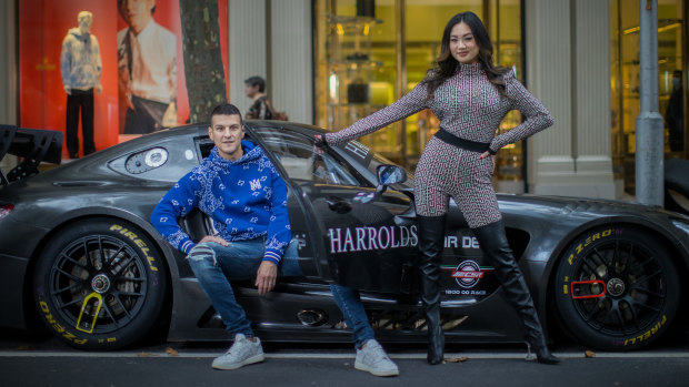 Harrolds managing director Ross Poulakis and women’s wear manager Jessica Poon in better times pose outside their flagship store in Melbourne.