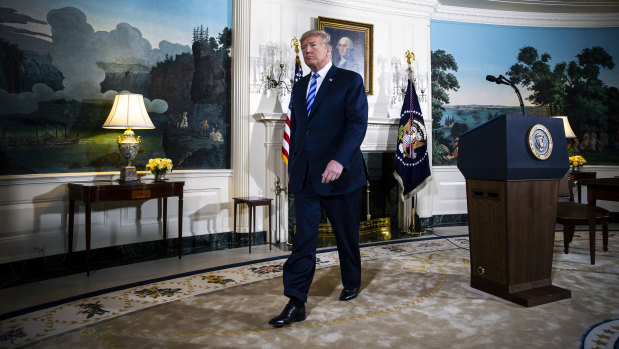 Donald Trump exits after speaking about the US exit from the Iran deal.