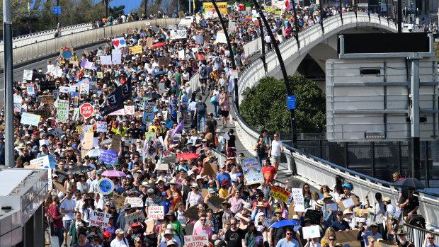 Organisers estimated more than 30,000 people marched across Victoria Bridge from Brisbane's CBD to South Brisbane on Friday. 