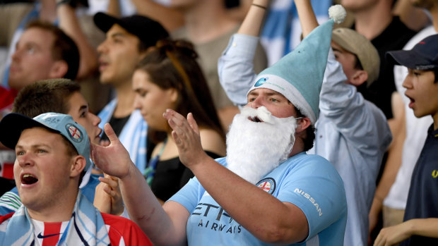 Christmas cheer: A Melbourne City supporter shares the spirit last year.