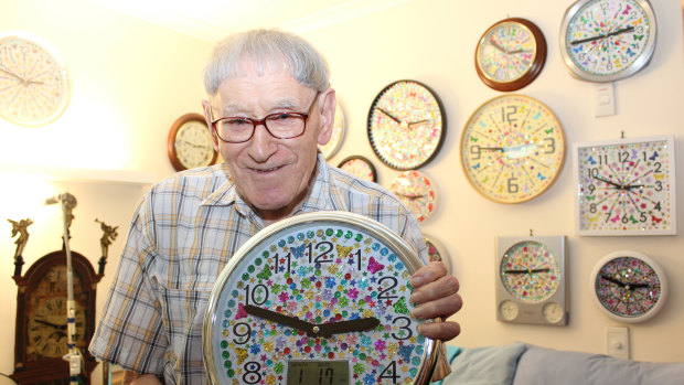 Jock Findlay with one of dozens of clocks he has made and decorated. 