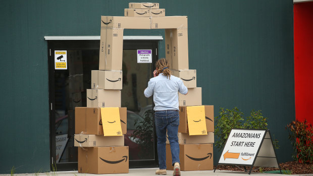 An employee enters Amazon's Melbourne warehouse on the day its local website went live. 