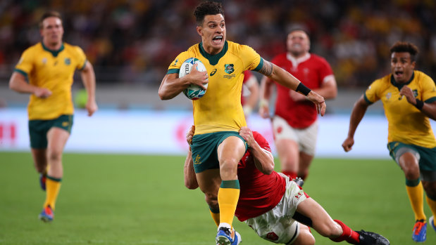 Rampaging run: Matt To'omua in action for the Wallabies against England at the 2019 Rugby World Cup.
