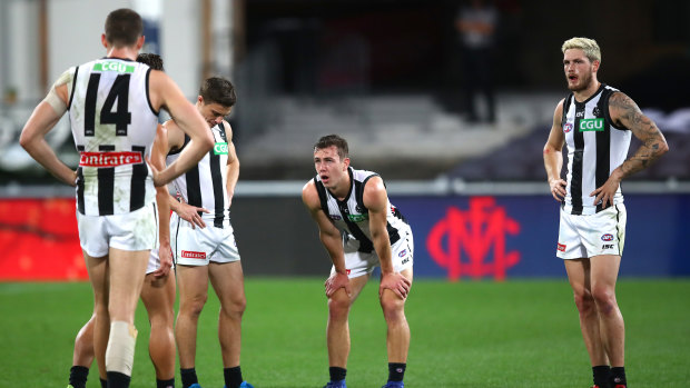 Flaky Pies: Collingwood players react after the loss to Melbourne.