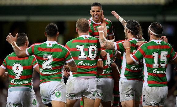 On song: Rabbitohs players rush in to congratulate five-eighth Cody Walker after his second-half try.