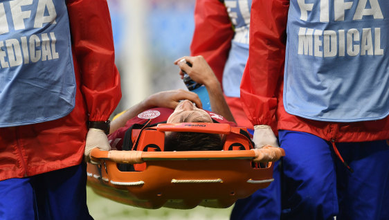 Denmark's William Kvist is stretchered from the field.