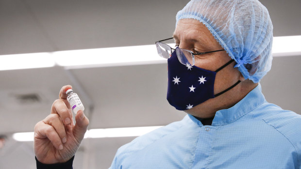 Prime Minister Scott Morrison with a vial of the Oxford-AstraZeneca vaccine in February. 