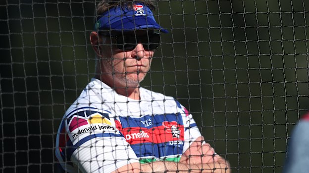 Knights coach Adam O'Brien is standing by Moses.