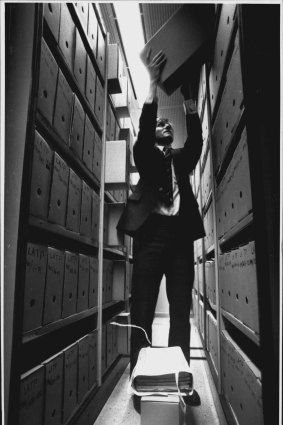 Leslie Gonye in the storage room containing 150 years worth of petitions to NSW parliament.