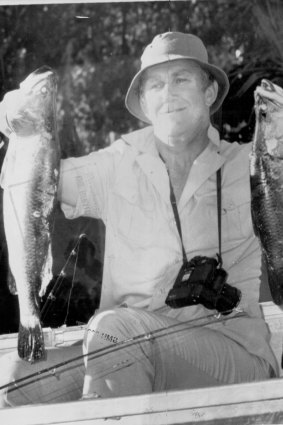 Malcolm Fraser showing off his catch in Arnhem Land after a fishing trip with Yunupingu.  