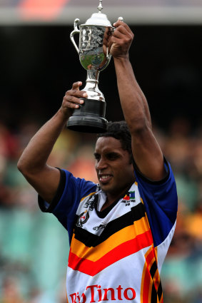 Preston Campbell holds up the trophy after the Indigenous side beat the New Zealand Maoris in the curtain-raiser to the opening game of the 2008 Rugby League World Cup.