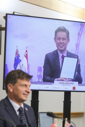 Singapore Minister for Trade and Industry Chan Chun Sing (seen on screen) speaks to Energy Minister Angus Taylor in October 2020.