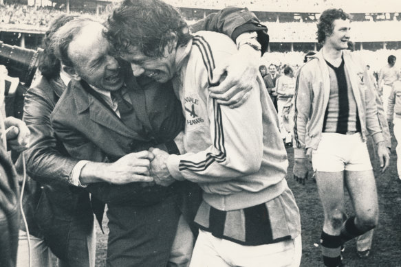 Kennedy hugs captain Don Scott after the '76 grand final.