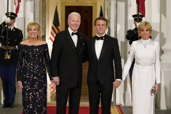 President Joe Biden and first lady Jill Biden greet French President Emmanuel Macron and his wife Brigitte Macron as they arrive for a state dinner at the White House in Washington on December 1.