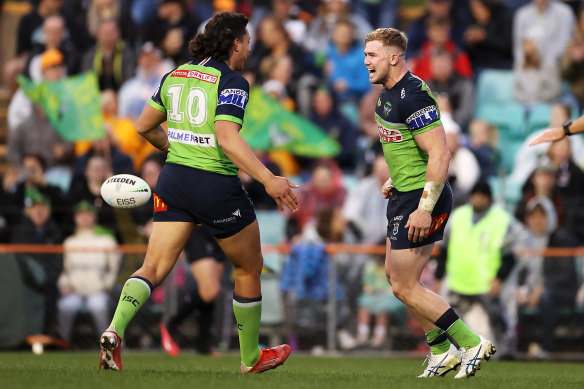 Hudson Young (right) celebrates one of his two tries with captain Joseph Tapine.