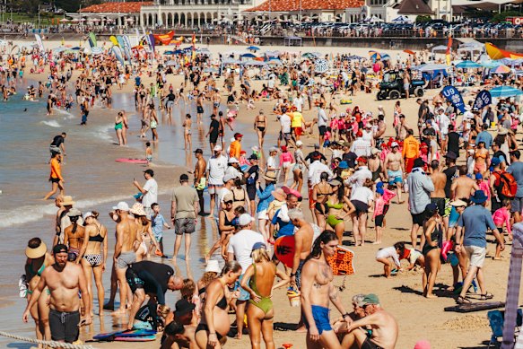 Revellers flock to Bondi Beach on a searing day.