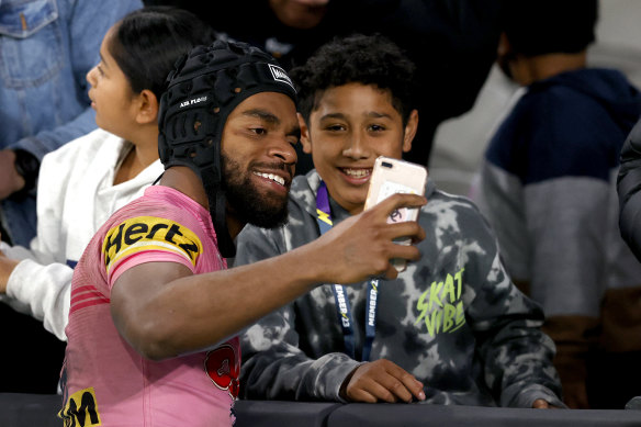 Sunia Turuva with a young fan after Penrith’s recent trip to Melbourne.