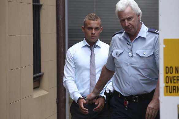 One-punch killer Kieran Loveridge is escorted from the NSW Supreme Court in November 2013.