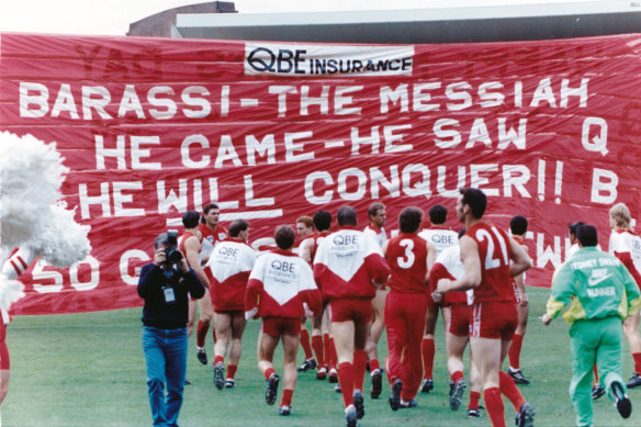 The Swans banner hails the arrival of Barassi in Sydney in 1993.