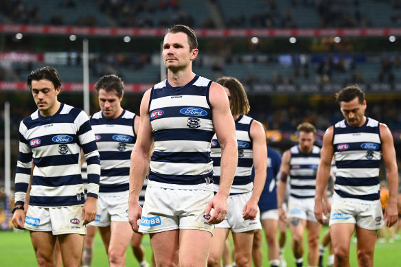 Patrick Dangerfield and the Cats leave the field after their loss to Hawthorn.