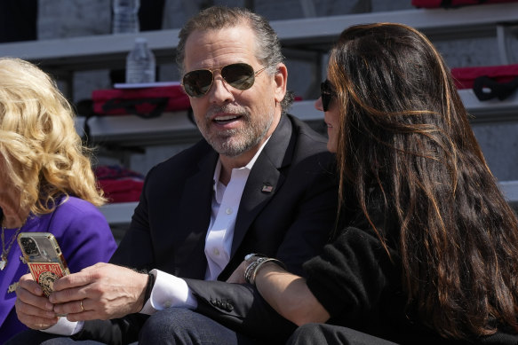 Hunter Biden talks with his sister Ashley as they attend his daughter’s university commencement ceremony last month.