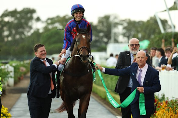Ben Elam, left, welcomes back Guest House and jockey Zac Lloyd after last Saturday’s Golden Slipper win.