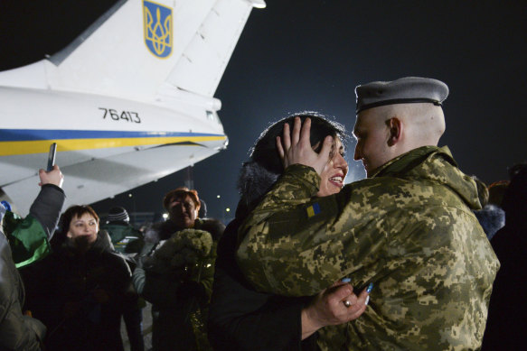 Yulia embraces her husband Olexander Korinkov, a Ukrainian soldier and prisoner of war released after a prisoner exchange, at Boryspil airport outside Kiev, Ukraine.