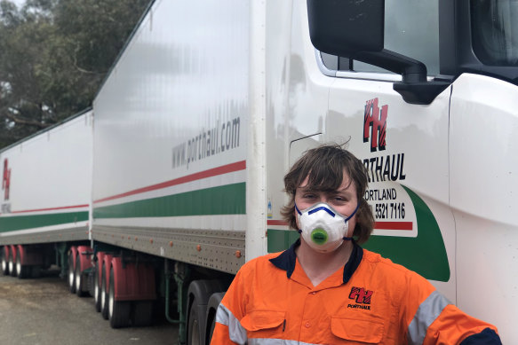 Road-train driver Rick McQuade returns to his truck on the South Australia-Victoria border after submitting to another of his weekly COVID-19 tests.