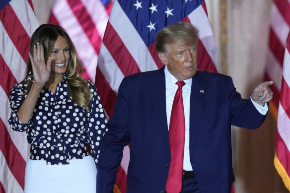 Donald Trump stands on stage with former first lady Melania Trump after announcing his third run for president.