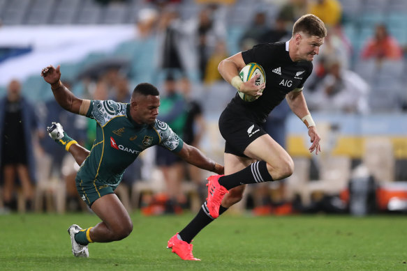 Jordie Barrett makes a break to score a try at ANZ Stadium.