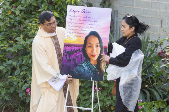 A picture of Logee Osias is placed at outside a church at a vigil for the mother of four held in Bendigo on Tuesday.