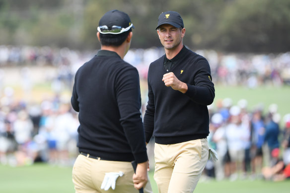 Adam Scott helps the Internationals to their second match point.