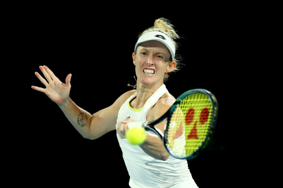 Storm Hunter puts everything into a forehand in her third round singles match at the Australian Open.