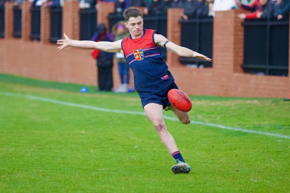 Harry Oliver prepares to kick long for Brighton Grammar.