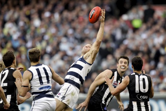 Cats ruckman Brad Ottens attempts to control a bounce at a stoppage.