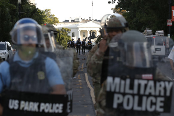 US Park Police and Military Police  clear the area around Lafayette Park.