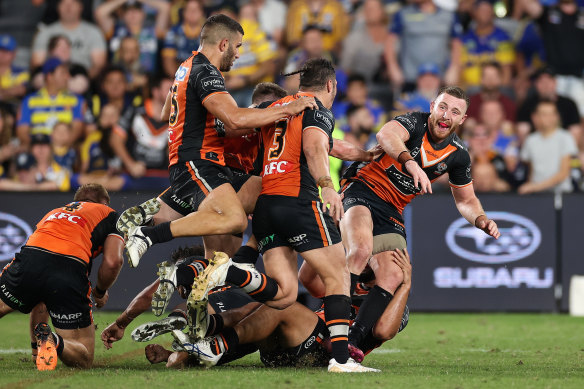 Wests Tigers’ Jackson Hastings celebrates kicking the winning field goal against the Eels.