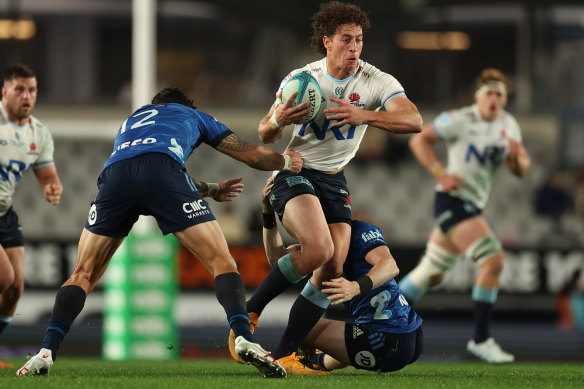 Mark Nawaqantiwase takes the ball forward for the Waratahs.