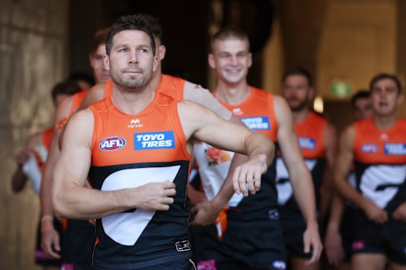 Greene leading the Giants onto the field.