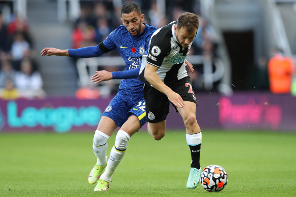 Ryan Fraser of Newcastle united vies with Hakim Ziyech of Chelsea.
