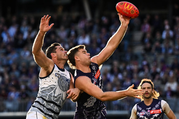 Tom Hawkins and Sean Darcy clash in the ruck during the Dockers’ win over Geelong at the weekend.