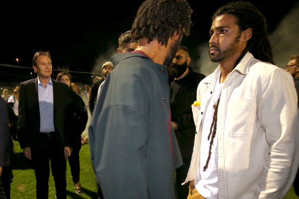 Collingwood president Jeff Browne (left) attempted to speak to Heritier Lumumba (middle). Joel Wilkinson is on the right.