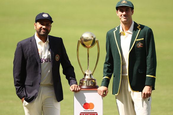 Opposing captains Rohit Sharma of India and Pat Cummins with the Border–Gavaskar Trophy in February. They meet again in the World Test Championship final, beginning on Wednesday.