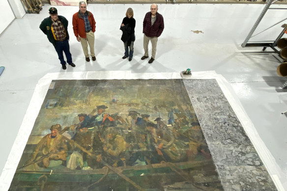 From left, Washington Crossing Park Association trustees Stan Saperstein and Michael Mitrano, conservator Christyl Cusworth and Washington Crossing Park Association board president Ken Ritchey next to the recently discovered mural.