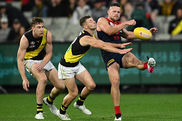 Steven May gets a kick away against the Tigers.