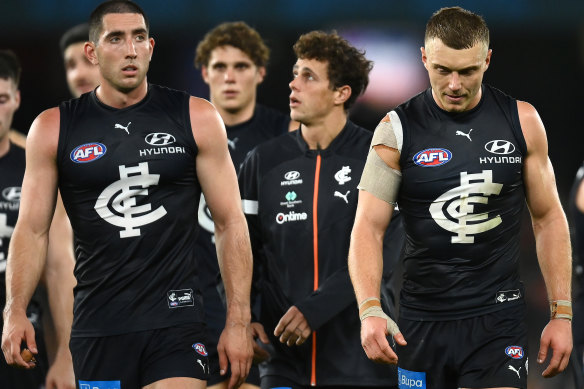 Patrick Cripps leads his team from the field after their loss to the Saints.