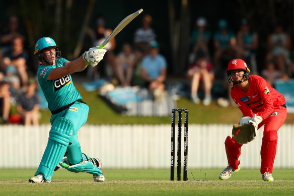 Grace Harris goes big against the Melbourne Renegades at  Allan Border Field on Saturday.