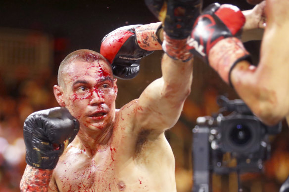 Bloody mess: Tim Tszyu (left) in the third round of his bout against Sebastian Fundora in Las Vegas.