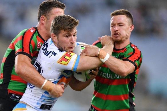 Jai Arrow could be playing alongside Souths' Damien Cook (right) next year instead of against him. 